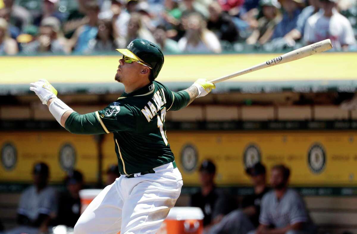 Oakland Athletics' Bruce Maxwell drives in two runs with a double against the Chicago White Sox during the third inning of a baseball game Wednesday, July 5, 2017, in Oakland, Calif. (AP Photo/Marcio Jose Sanchez) ORG XMIT: OAS107