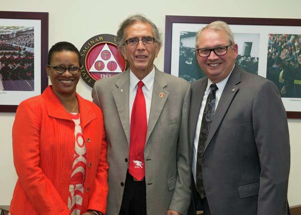 Saginaw Valley State University's Cathy Ferguson, left, David Gamez and Donald Bachand, right, pose for a photo. (Photo provided)