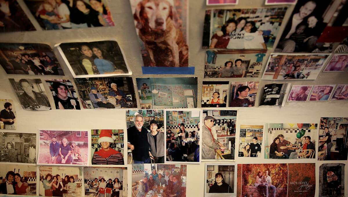 Thirty-five years worth of memories line the walls of the bathroom Toy Boat Dessert Cafe in the Inner Richmond on Thursday, July 6, 2017. Jesse Fink and his wife, Roberta, have run the cafe for 35 years.