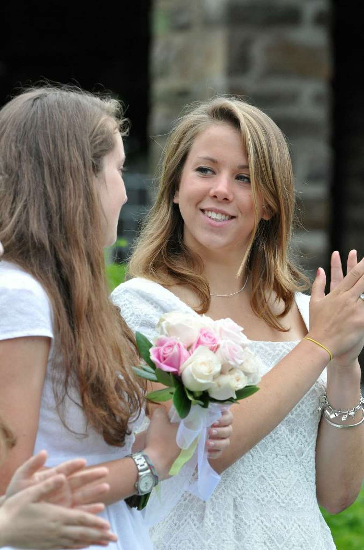 Grace Comann, of Fairfield, applauds during Greens Farms Academy eighty-fifth commencement on Thursday, June 10, 2010.