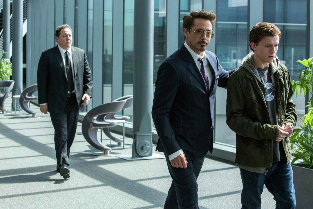This image released by Columbia Pictures shows Jon Favreau, from left, Robert Downey Jr. and Tom Holland in a scene from "Spider-Man: Homecoming." (Chuck Zlotnick/Columbia Pictures-Sony via AP) ORG XMIT: NYET456