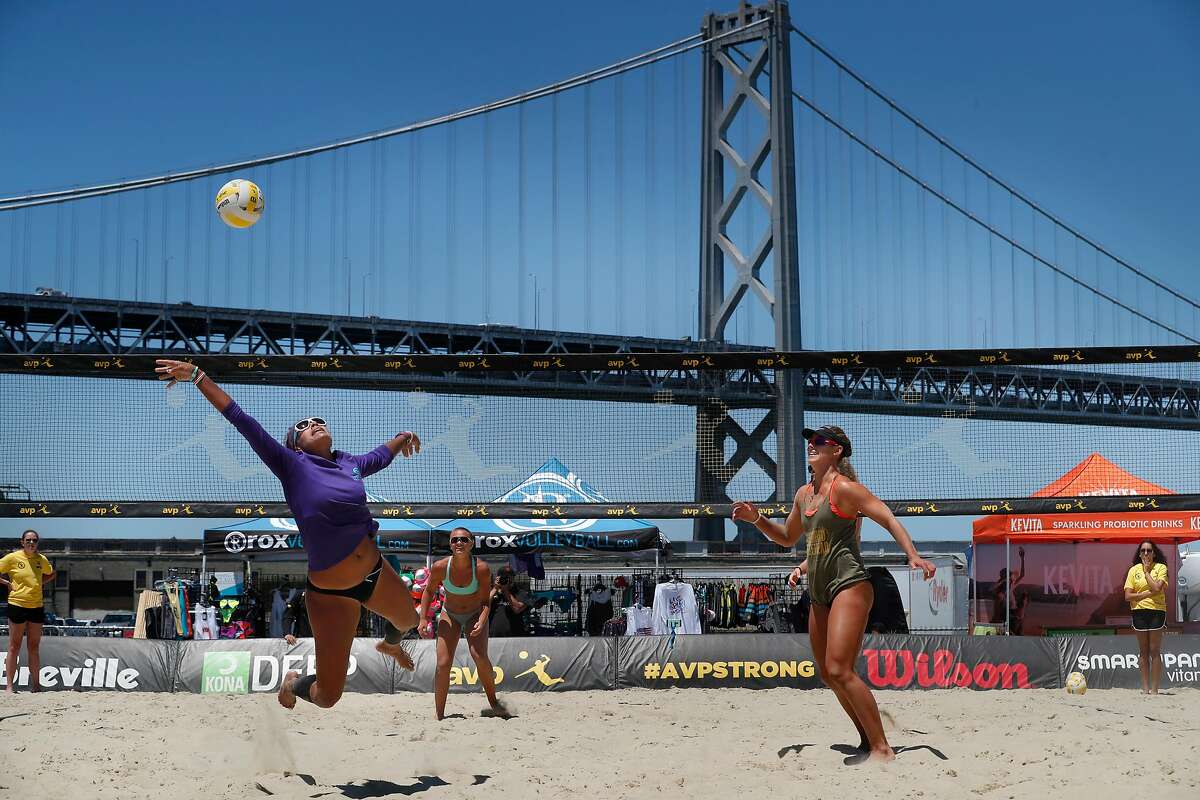 The team of Pricilla Pianidosi-Lima, (diving for the ball) and Kerri Schuh, (right ) and Pricilla Pianidosi-LIma, (back right) battle the team of Bella Kuechenberg, (pictured far side) and Shannon Murphy, (not pictured) in a qualifying round as the AVP Tour makes a stop in San Francisco, Ca., on Thursday July 6, 2017. The competition runs through this weekend.