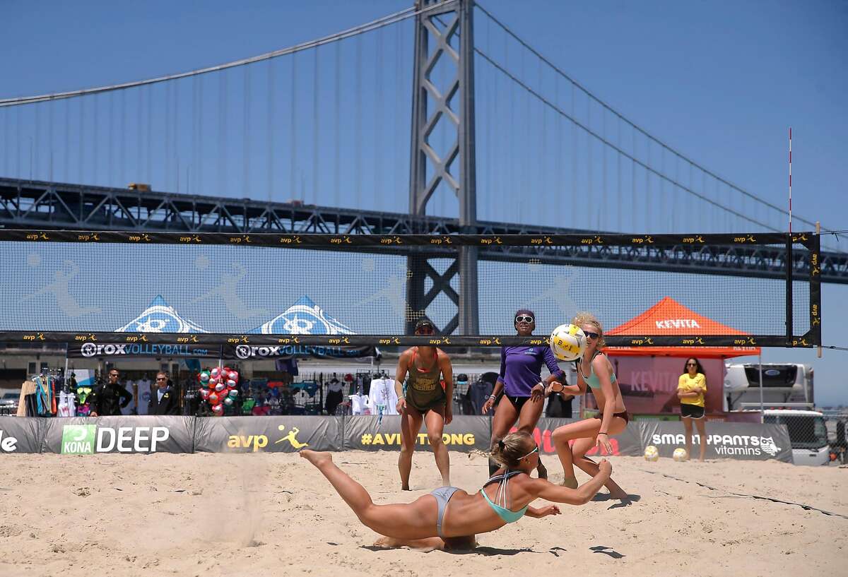 The team of Kerri Schuh, (back left) and Pricilla Pianidosi-Lima, (back right) battle with Bella Kuechenberg, (diving for a ball) and Shannon Murphy in a qualifying round as the AVP Tour makes a stop in San Francisco, Ca., on Thursday July 6, 2017. The competition runs through this weekend.