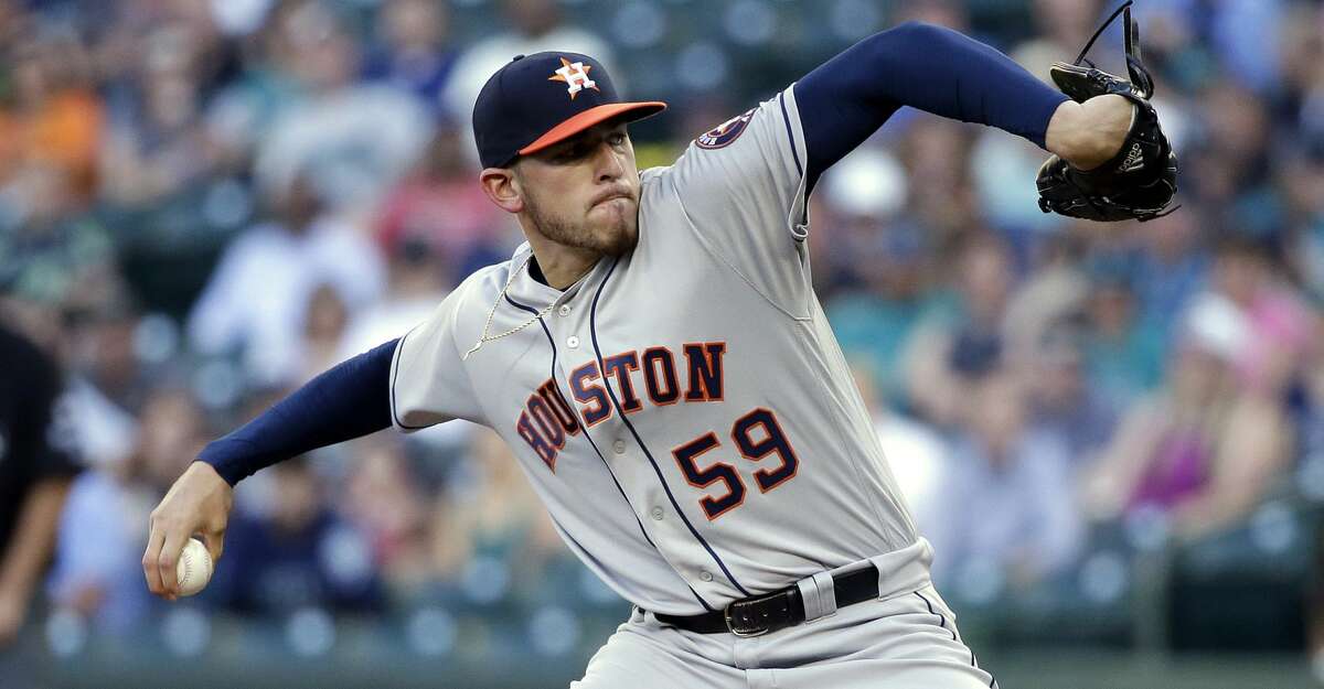 Houston Astros starting pitcher Joe Musgrove throws to a Seattle Mariners batter during the first inning of a baseball game Friday, June 23, 2017, in Seattle. (AP Photo/Elaine Thompson)