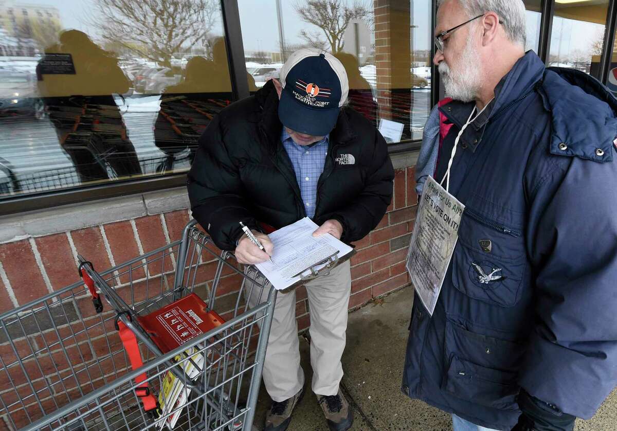 Volunteer Bob Rybak in 2016 gathers signatures to put the sale of Shenendehowa school land to a district-wide referendum.