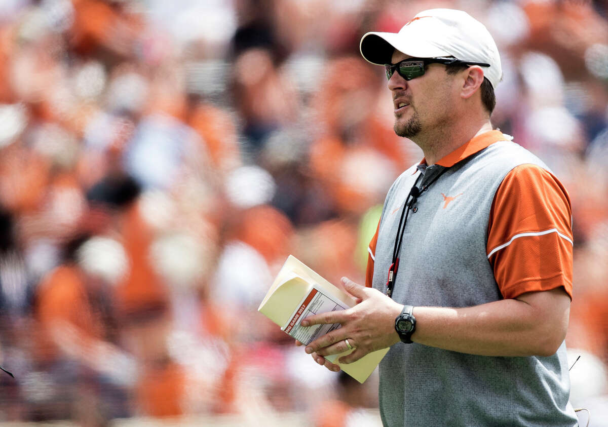 FILE - In this April 15, 2017, file photo, Texas head coach Tom Herman looks on during the Orange and White spring NCAA college football game in Austin, Texas. For the sake of the Big 12, new Oklahoma coach Lincoln Riley and Herman better live up to the hype. Following a season in which Big 12 football bottomed out, and with speculation about the long-term viability of the conference a constant talking point, its flagship programs are now both in transition. (Ricardo B. Brazziell/Austin American-Statesman via AP, File
