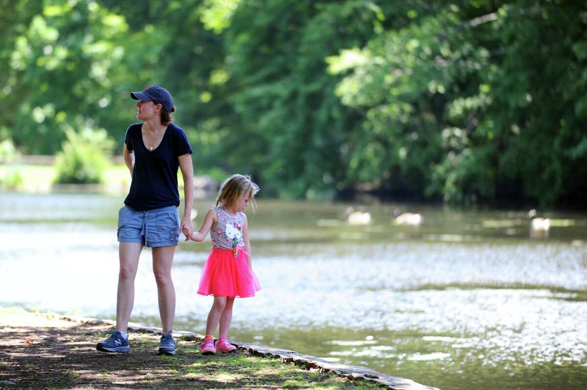 Five-year-old Reagan Walsh, of Westport, looks out over Bendels Pond with her mom Dianna Walsh in the Stamford Musem & Nature Center July 2.