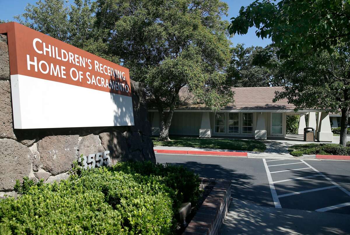 The main entrance of the Children's Receiving Home of Sacramento is seen on Auburn Boulevard in Sacramento, Calif. on Friday, July 7, 2017. For the past year and a half, in violation of state health and safety laws, hundreds of children awaiting foster care placement in Sacramento County have had to sleep in the lobby of the county child welfare system's central intake office here, or in an adjacent pair of "Comfort Rooms," often in cots, fold-up mats and air mattresses.