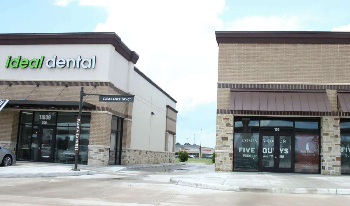 Smaller businesses outside of the anchor stores are open such as Ideal Dental (left) while others are coming soon hopefully within the year such as Five Guys Burgers (right).