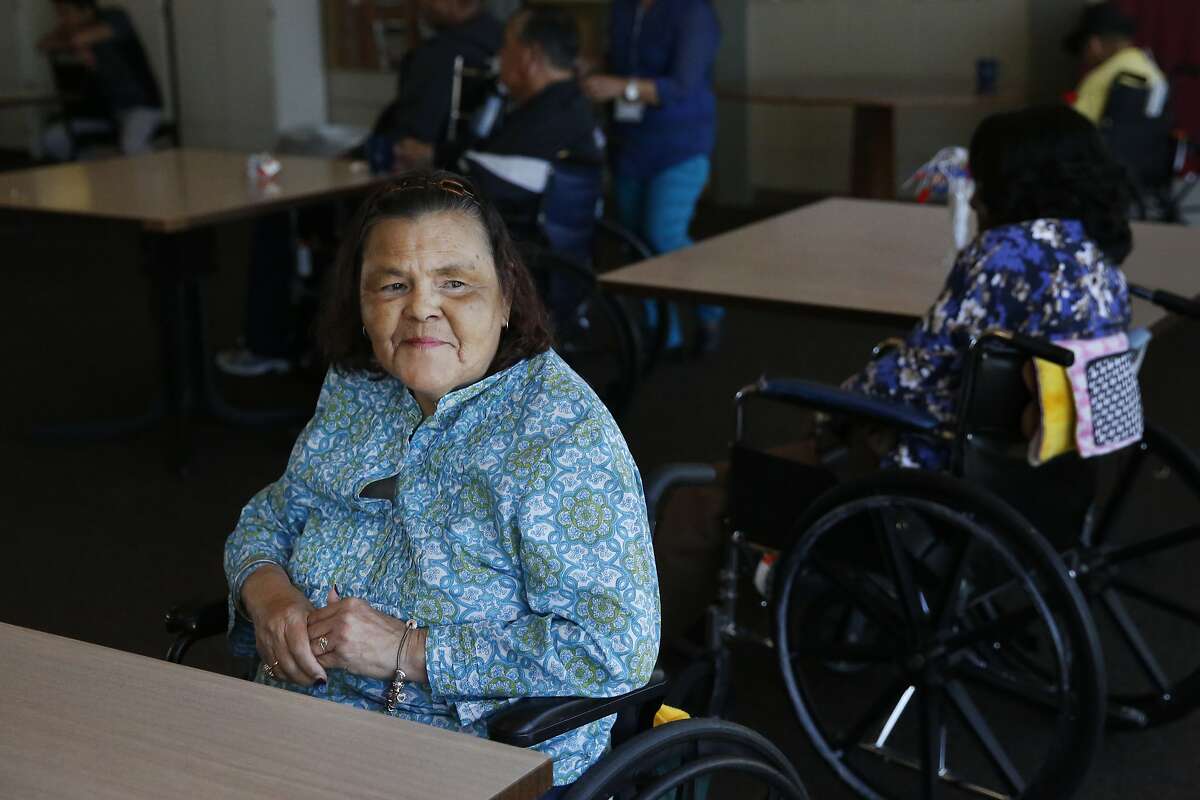 Catherine Araujo, 65, waits for live music in the community room at the Waters Edge skilled nursing facility July 7, 2017 in Alameda, Calif. Photo: Leah Millis, The Chronicle