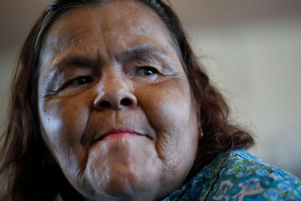 Catherine Araujo, 65, waits for live music in the community room at the Waters Edge skilled nursing facility. Photo: Leah Millis, The Chronicle