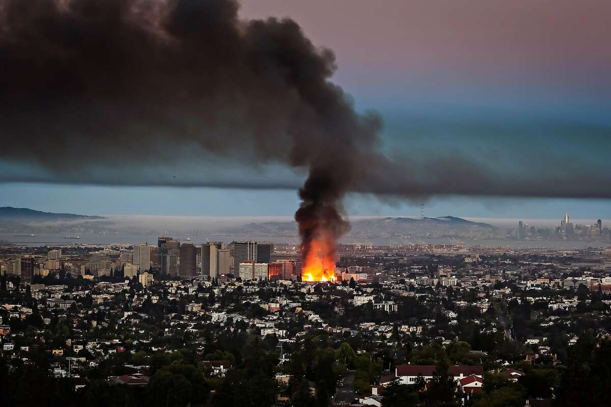 A massive fire at a downtown Oakland construction site as seen from the Oakland Hills on July 7, 2017 at approximately 5:25 am PST.