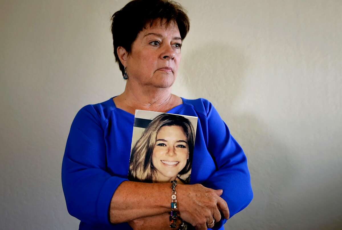 Liz Sullivan at her home in Livermore, Calif., the mother of Kate Steinle holds a photo of her daughter who was shot and killed on Pier 14 in July, in San Francisco, Calif.