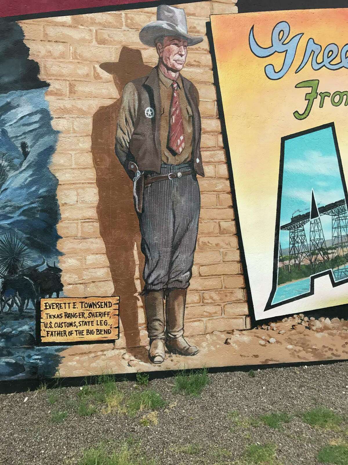 From a mural in downtown Alpine, Brewster County Sheriff E.E. Townsend still keeps an eye on things.