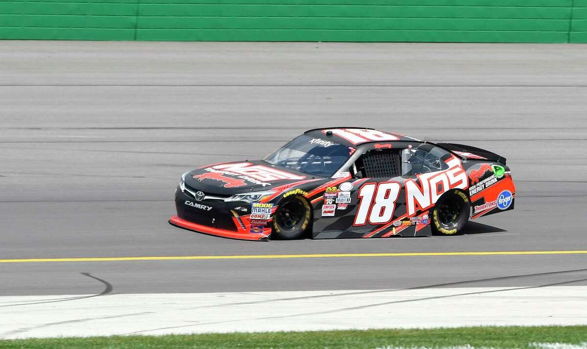 Xfinity Series driver Kyle Busch (18) comes out of turn 4 during the NASCAR Xfinity auto race at Kentucky Speedway, Saturday, July 8, 2017, in Sparta, Ky. (AP Photo/Timothy D. Easley)