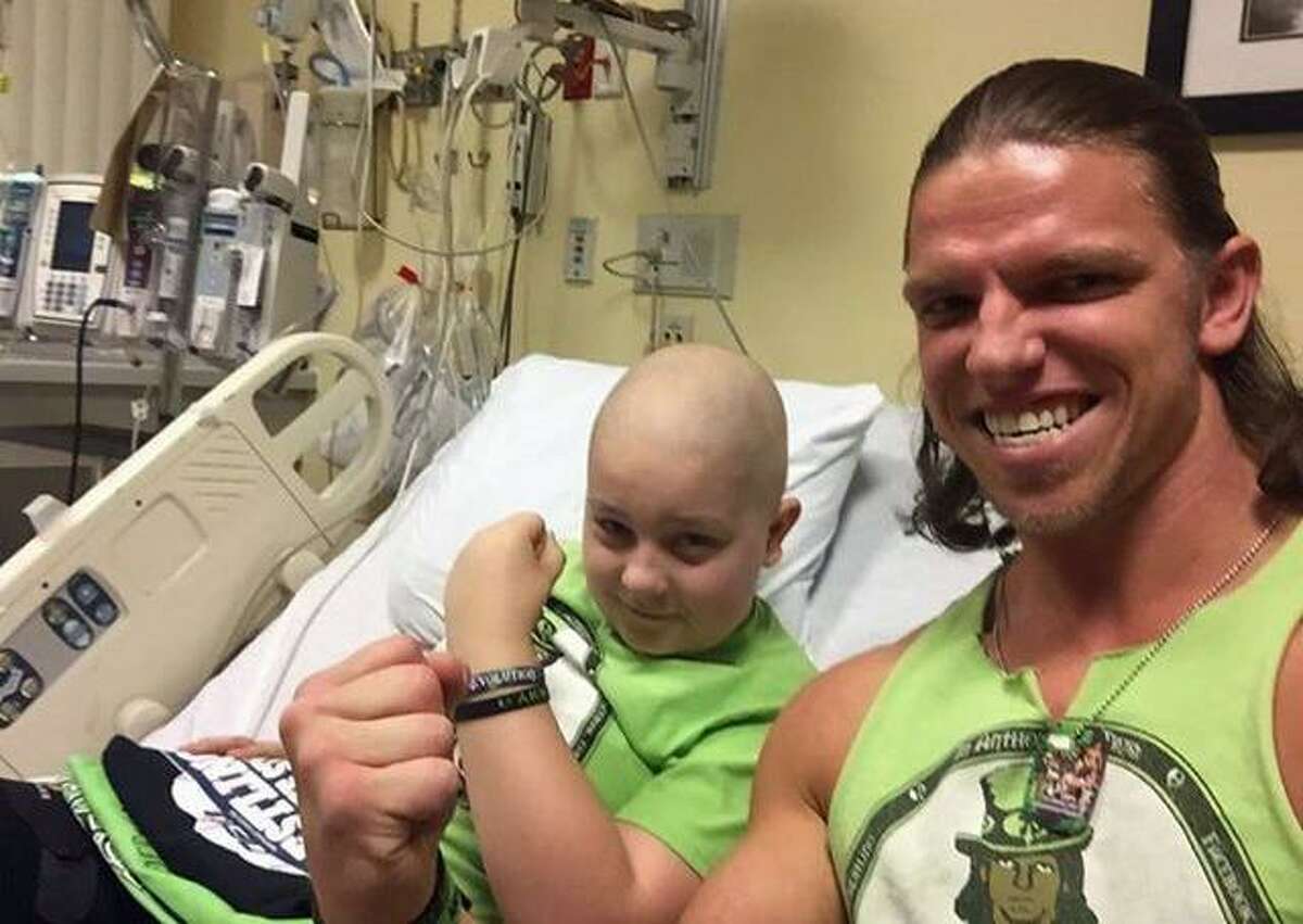 Brian “Anthony” (Ciskowski) and Daniel Therriault pose for a photo at the Connecticut Children’s Medical Center last May. Ciskowski is headlining a Northeast Wrestling show this Friday at the Danbury PAL Building