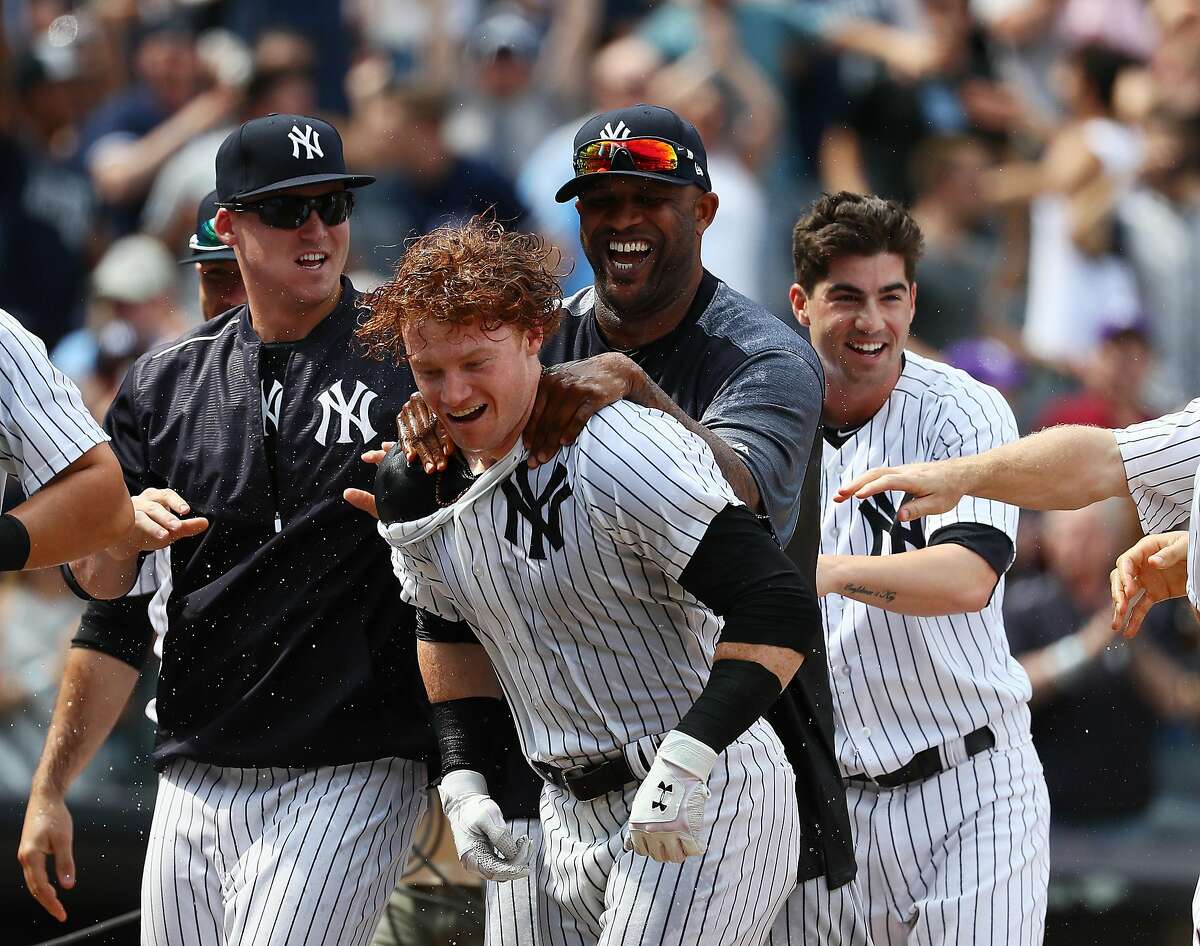 NEW YORK, NY - JULY 08: Clint Frazier #30 of the New York Yankees celebrates a three run walk off home run in the ninth inning against the Milwaukee Brewers with a 5-3 win during their game at Yankee Stadium on July 8, 2017 in New York City. (Photo by Al Bello/Getty Images)