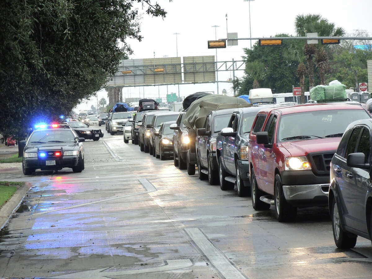 Laredo police units block intersections near the downtown area as south bound traffic heads toward the Juarez-Lincoln International Bridge.