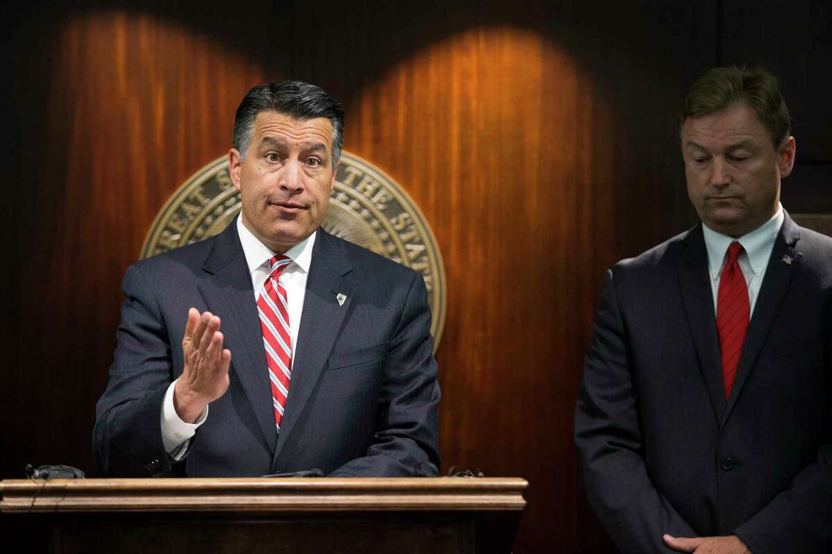 FILE - In this Friday, June 23, 2017 file photo, Gov. Brian Sandoval, left, and U.S. Sen. Dean Heller, R-Nev., give a news conference in Las Vegas where the senator announced he will vote no on the proposed GOP healthcare bill. A handful of Republican governors, including Sandoval, who support some of the key pillars of former President Barack ObamaÂ?’s health care law are among the main reasons Senate leaders cannot persuade enough Republicans to get behind their repeal-and-replace effort. (Erik Verduzco/Las Vegas Review-Journal via AP)