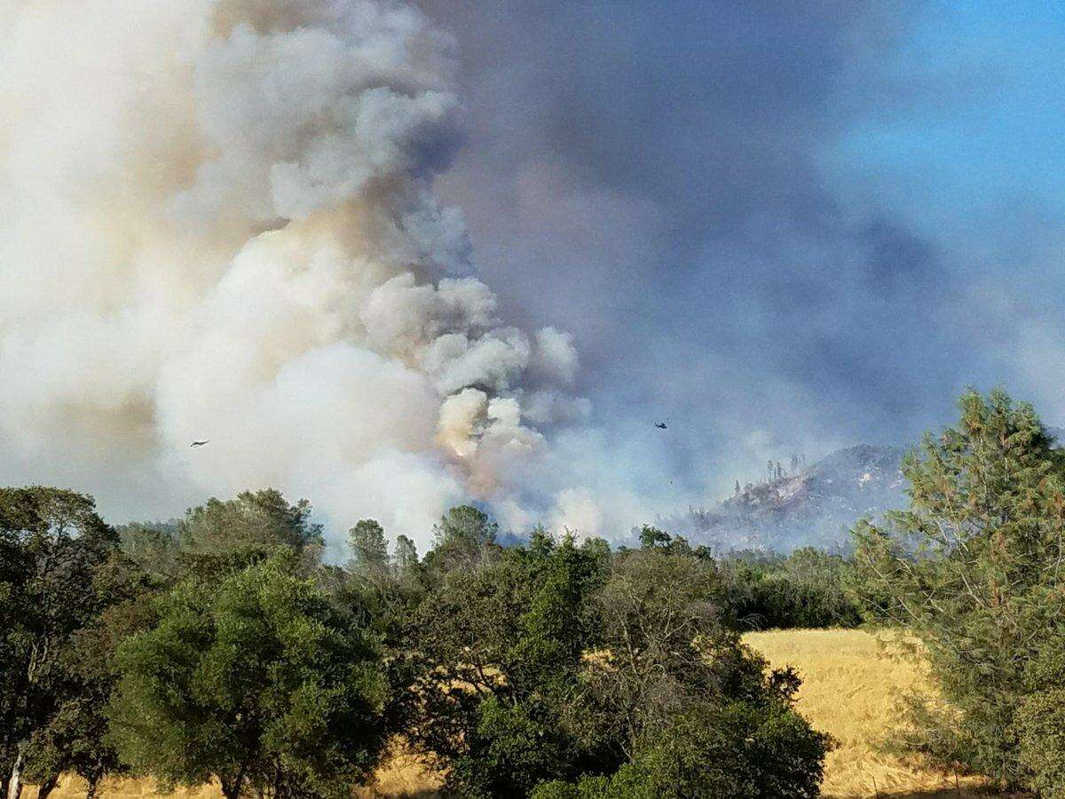 Smoke rises over the Wall Fire in Butte County.
