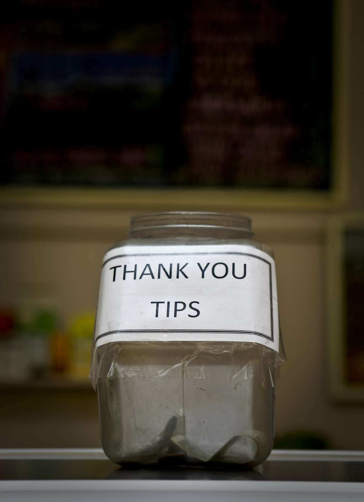 The tip jar at Arguello Super Market in San Francisco, Calif. is seen on Wednesday, Feb. 24, 2010.