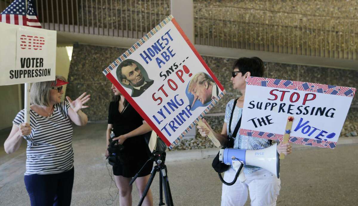 Protesters gather outside the federal courthouse on July 10, 2017, in San Antonio, where a redistricting trial was taking place.