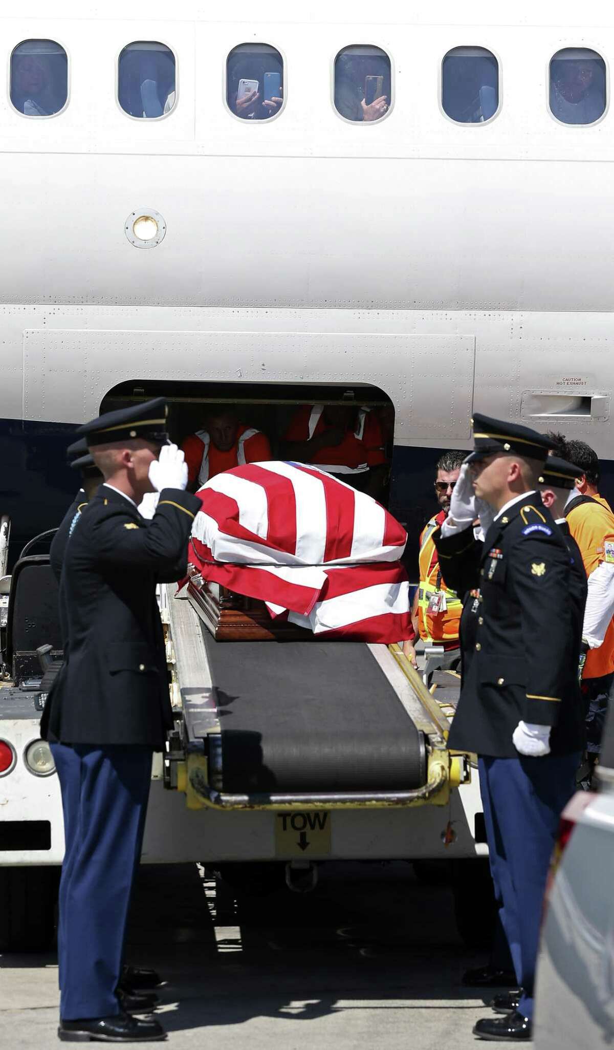 The remains of Cpl. Frank Luna Sandoval arrive at the San Antonio International Airport, Monday, July 10, 2017. Sandoval was missing action and presumed dead since the Korean War. Sandoval was 20-years-old when he was take as a prisoner of war and died of malnutrition. His family was on the tarmac to receive the remains.