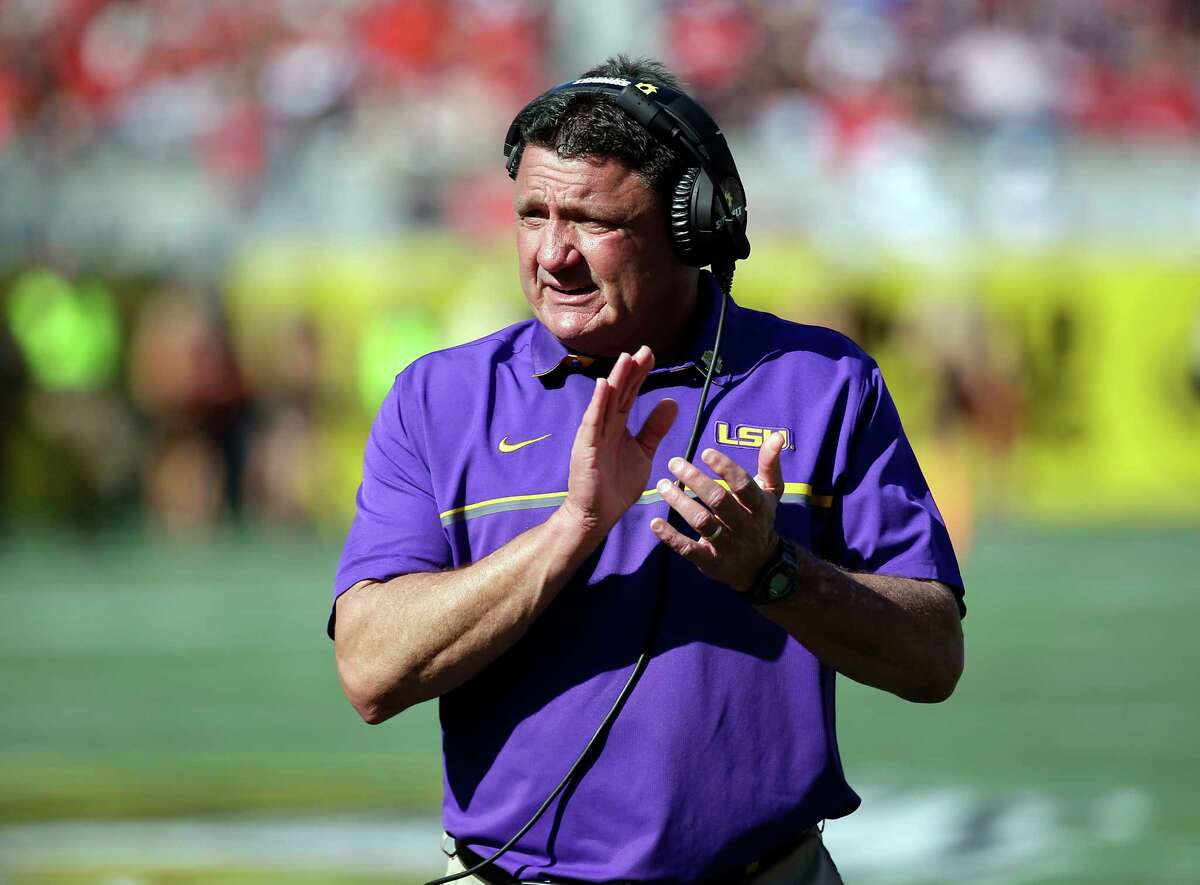 FILE - In this Dec. 31, 2016, file photo, LSU coach Ed Orgeron encourages players during the second half of the Citrus Bowl NCAA football game against Louisville in Orlando, Fla. Orgeron will be one of the coaches to take the podium Monday, July 10, 2017, at the SEC media days in suburban Birmingham, Ala. (AP Photo/John Raoux, File)