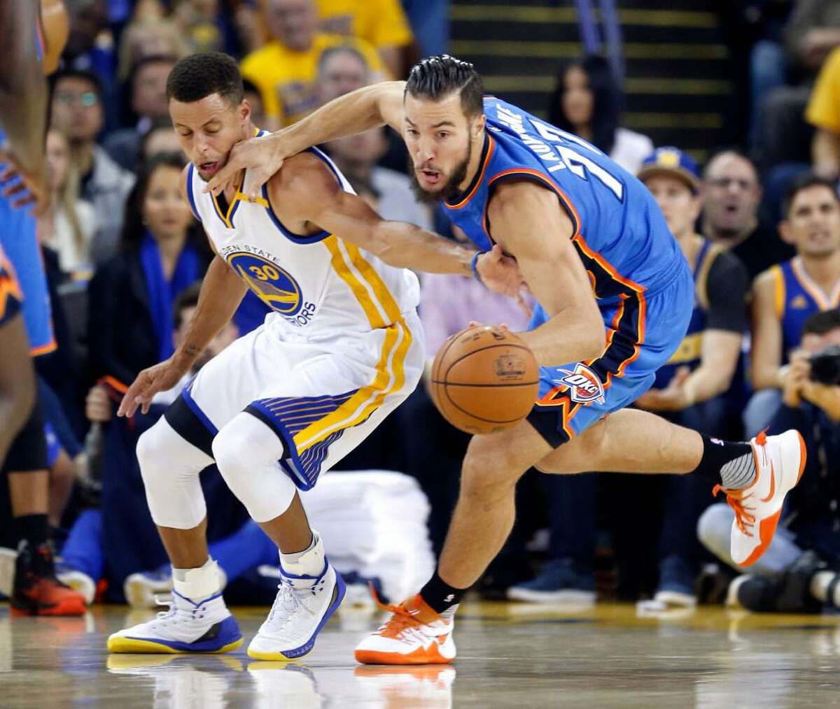 Golden State’s Stephen Curry defends against Oklahoma City’s Joffrey Lauvergne during a Nov. 3, 2016 game at Oracle Arena in Oakland, Calif.