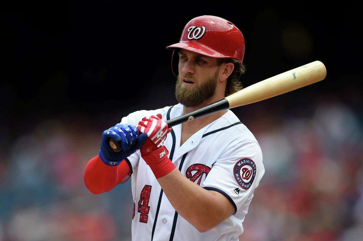 Washington Nationals' Bryce Harper wears stars and stripes on his batting gloves during his at bat in the fifth inning of a baseball game against the New York Mets, Tuesday, July 4, 2017, in Washington. (AP Photo/Nick Wass)