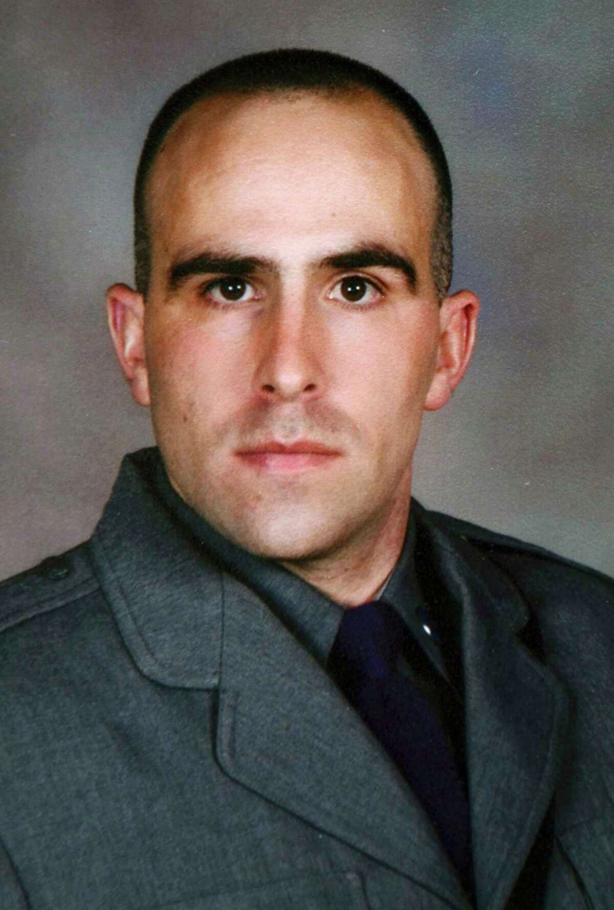 This undated photo provided by the New York State Police shows Trooper Joel Davis, who was fatally shot responding to a domestic dispute in Theresa, N.Y., on Sunday, July 9, 2017. Justin Walters, a U.S. Army soldier, was charged Monday, July 10 with murder in the shooting. (New York State Police via AP)
