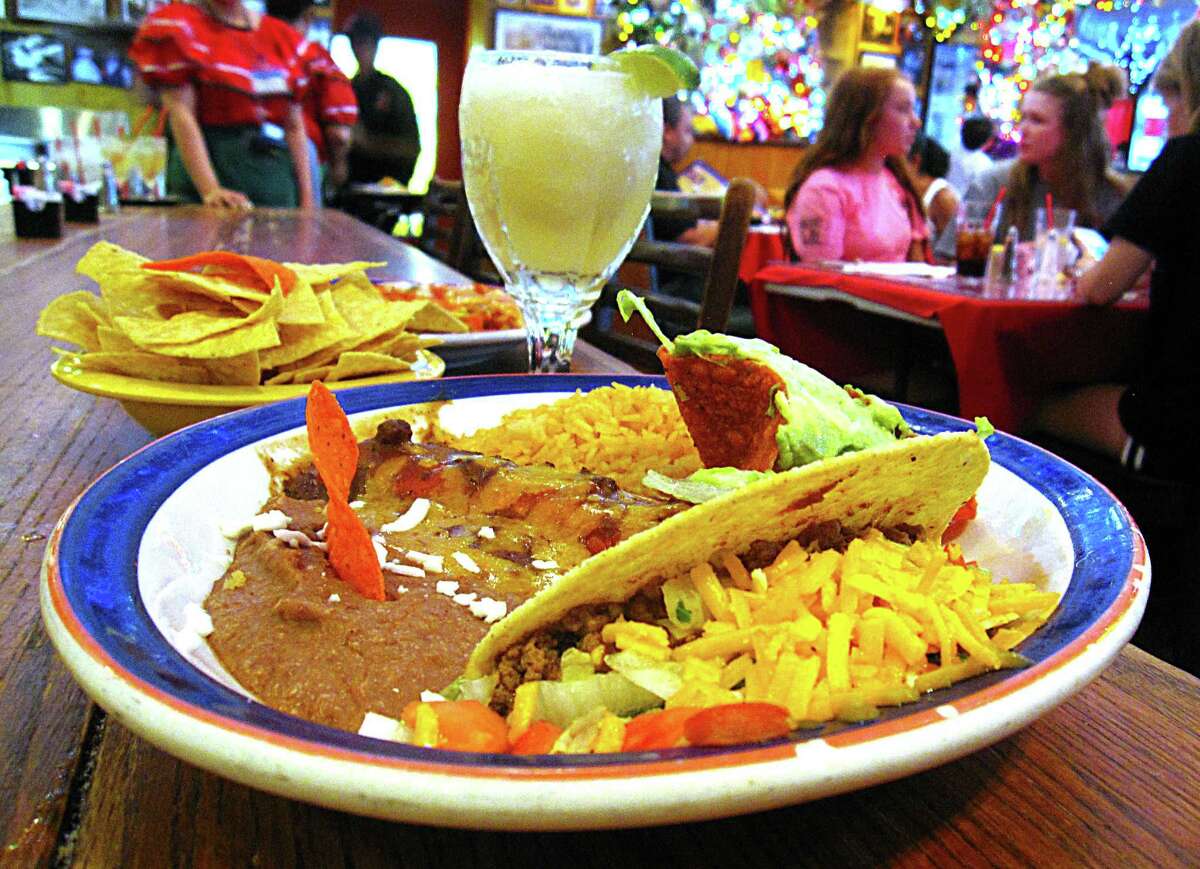 The George's Special plate includes a crispy beef taco, cheese enchilada, rice, beans and guacamole at Mi Tierra Cafe y Panadería.
