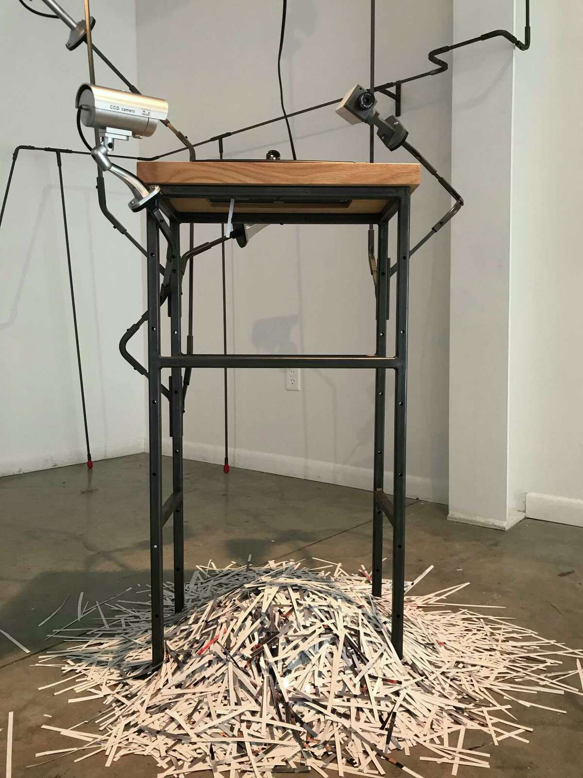 A view of Edward Kelley's interactive installation "Speak of the Devil," which contains working surveillance cameras, at Art League Houston through July 22.