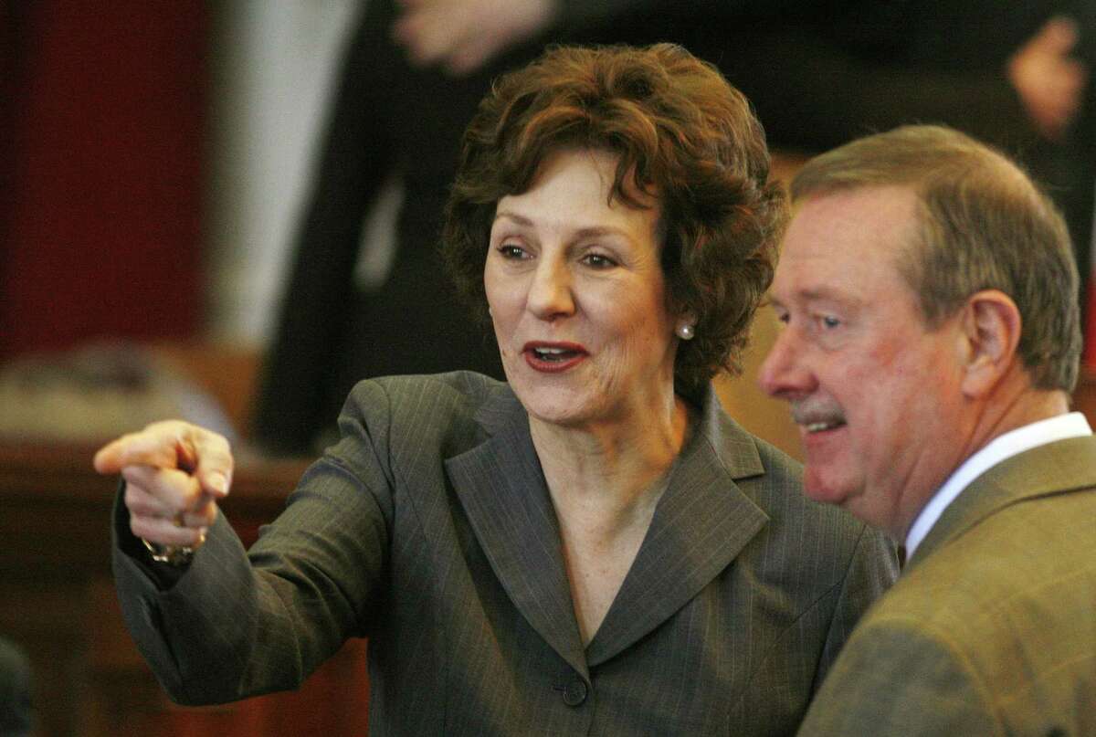 Comptroller Susan Combs (left) and Rep. Ralph Sheffield, R-Temple, attend the State of the State address at the Capitol in Austin on Feb. 8, 2011.