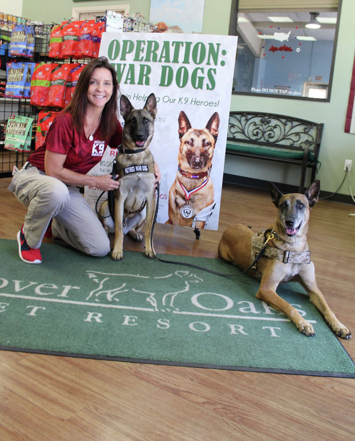 Kristen Maurer, founder and president of Mission K9 Rescue with retired war dogs Gina and Kilo visting Rover Oaks Pet Resort.