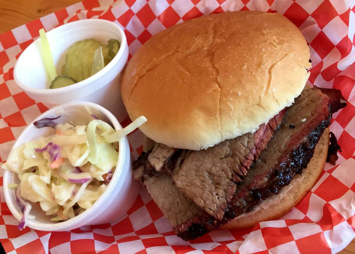 Brisket sandwich with slaw and pickles at Orly's BBQ.
