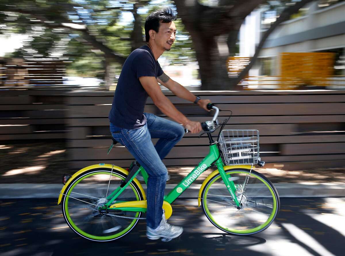 Brad Bao, co-founder and chairman of Lime Bike, takes a spin on a bicycle in San Mateo, Calif. on Tuesday, July 11, 2017. Lime Bike hopes to deploy as many as 3,000 of its undocked and station-less bike-share bicycles on the streets of San Francisco as soon as the permitting process is completed.