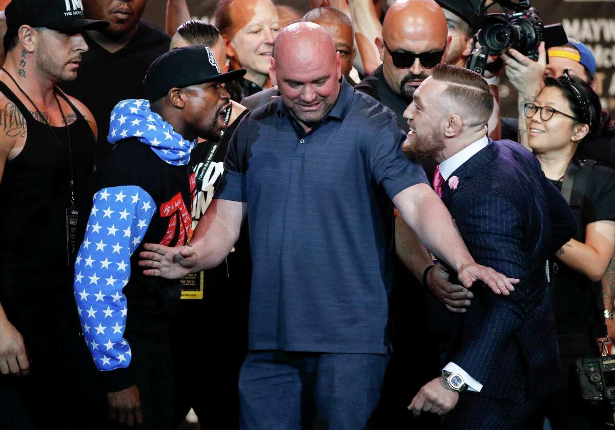 PHOTOS: A look at the craziness of the first Floyd Mayweather-Conor McGregor press conference UFC president Dana White, center, intervenes as boxer Floyd Mayweather Jr., left, and mixed martial arts fighter Conor McGregor exchange words during a news conference at Staples Center Tuesday, July 11, 2017, in Los Angeles. The two are scheduled to fight in a boxing match in Las Vegas on Aug. 26. (AP Photo/Jae C. Hong) Browse through the photos to see what the first Floyd Mayweather-Conor McGregor press conference was like.