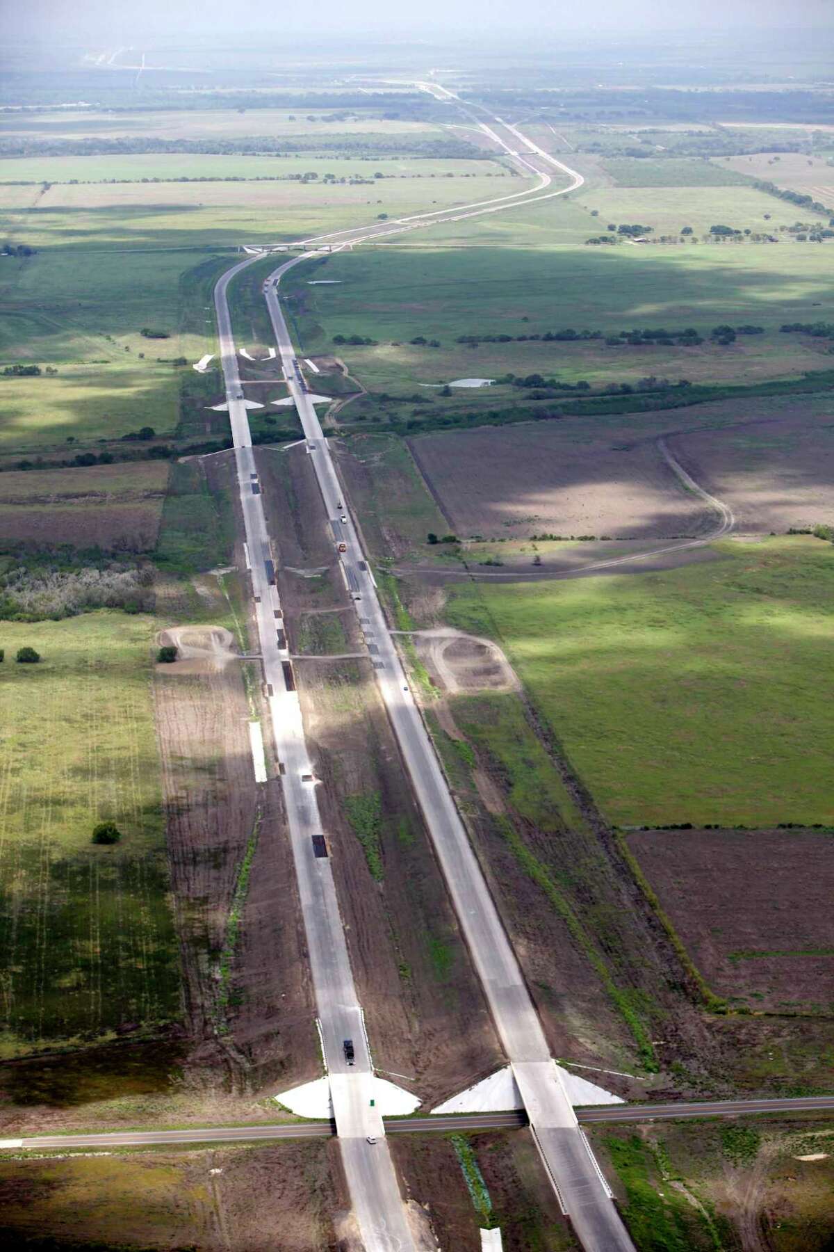 Not all public-private partnerships work well for infrastructure projects. Take the Texas 130 toll road that bypasses Interstate 35 between Austin and San Antonio, seen here still under construction in 2012. Toll revenues did not meet expectations.
