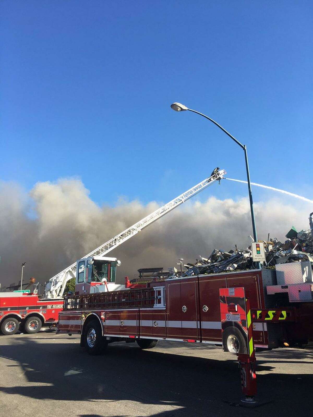 Fire at San Leandro salvage yard under control after hours