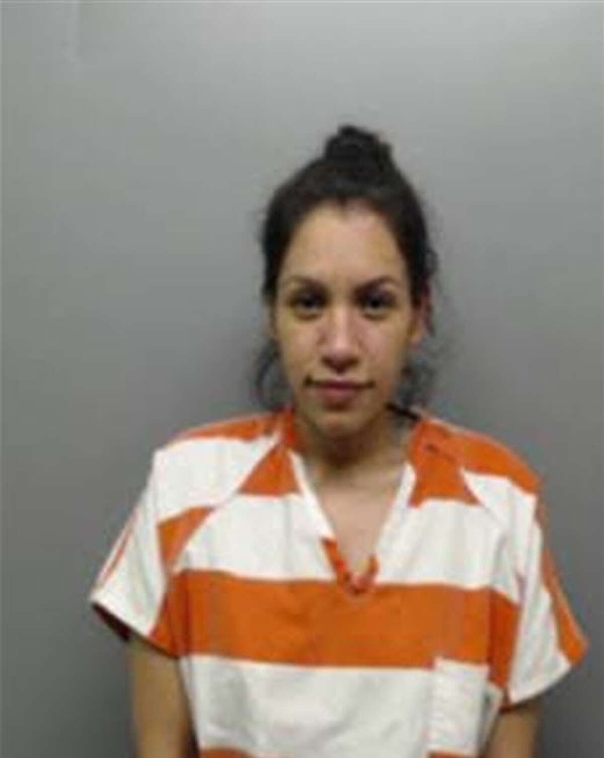 Michelle Garza, 25, was charged with aggravated assault with a firearm, unlawful possession of a firearm by a felon, two counts of possession of a controlled substance, engaging in organized criminal activity and failure to identify a fugitive from justice.