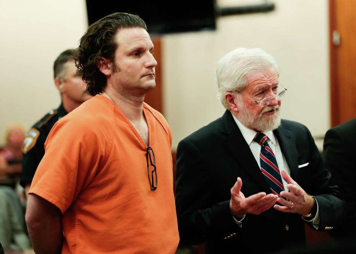 Leon Jacob, center, appears with his attorney, George Parnham, before felony judge Jim Wallace to request bond on Wednesday, July 12, 2017, in Houston. Jacob is being held without bail, accused in a murder-for-hire plot involving his girlfriend, a prominent Montrose veterinarian, in an alleged scheme to kill their exes.