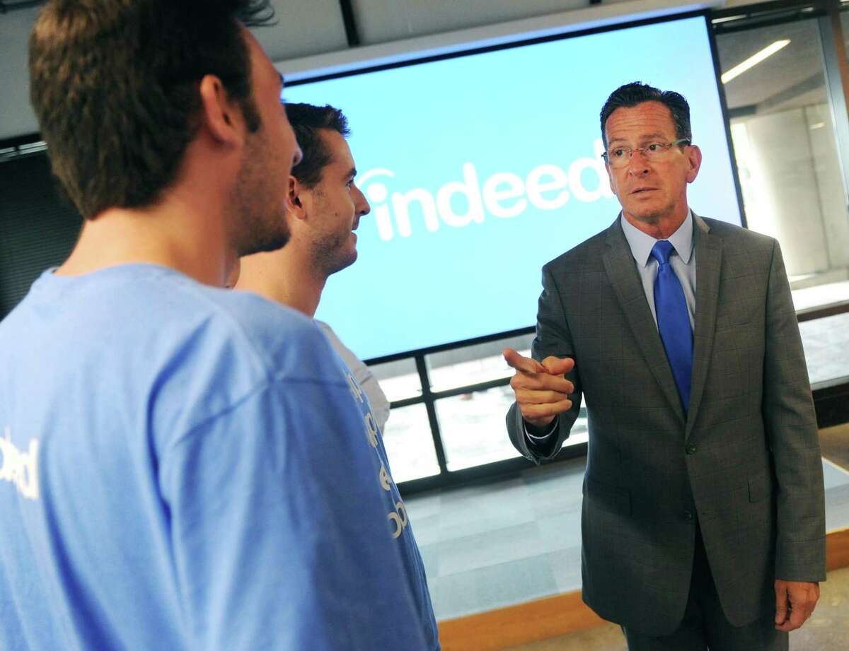 Connecticut Gov. Dannel P. Malloy chats with employees after making an announcement at the Indeed headquarters in Stamford. Online job-search giant Indeed plans to create up to 500 new jobs over the next few years through tens of millions of dollars in company investment and state aid, Gov. Dannel P. Malloy and company executives announced Wednesday.