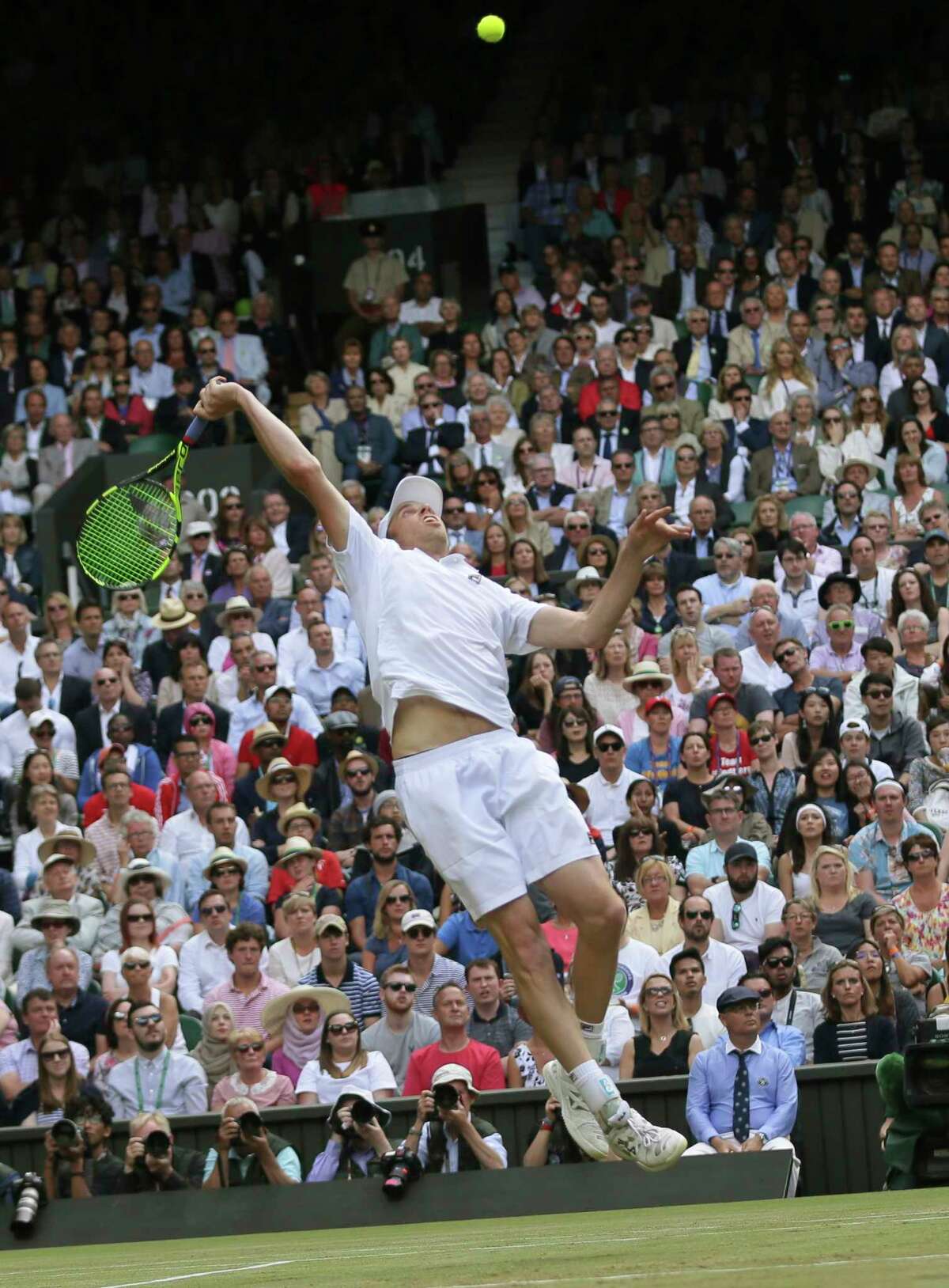 Sam Querrey of the United States smashes a winner against Britain's Andy Murray during their Men's Singles Quarterfinal Match on day nine at the Wimbledon Tennis Championships in London Wednesday, July 12, 2017. (AP Photo/Tim Ireland)
