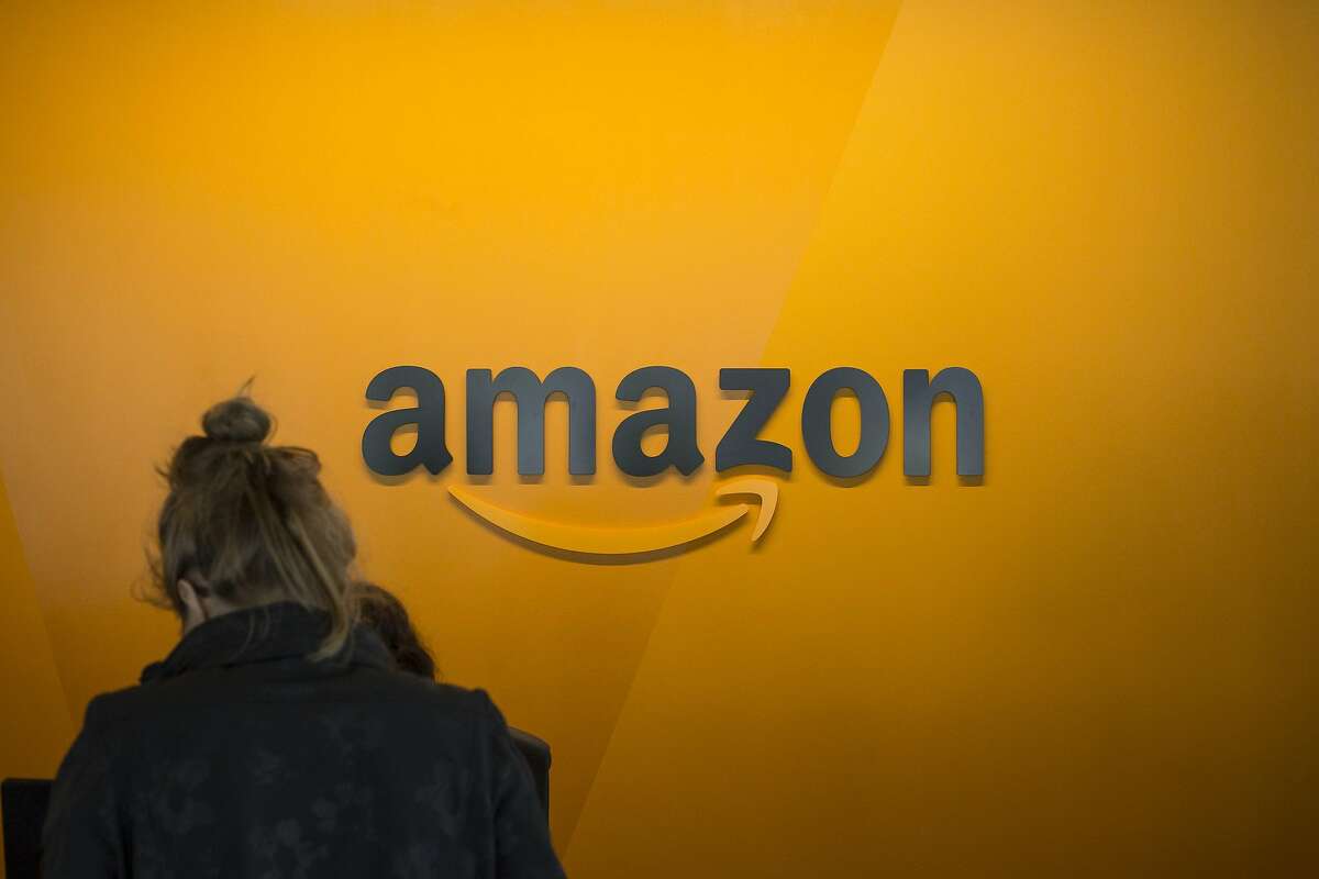 SEATTLE, WA - JUNE 16: A visitor checks in at the Amazon corporate headquarters on June 16, 2017 in Seattle, Washington. Amazon announced that it will buy Whole Foods Market, Inc. for over $13 billion. (Photo by David Ryder/Getty Images)
