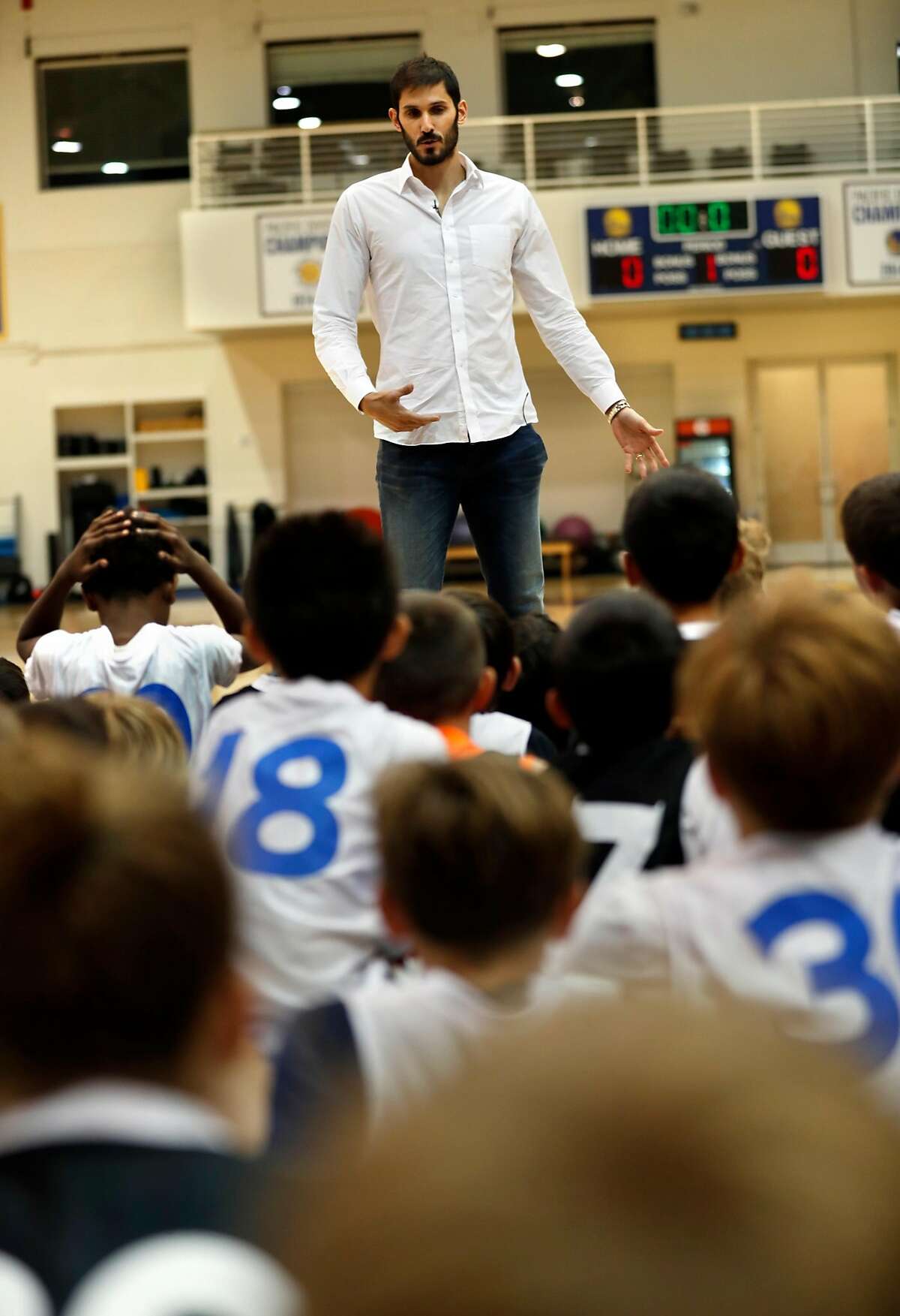 Golden State Warriors' Omri Casspi talks to basketball campers after Casspi was introduced in Oakland, Calif. on Wednesday, July 12, 2017.
