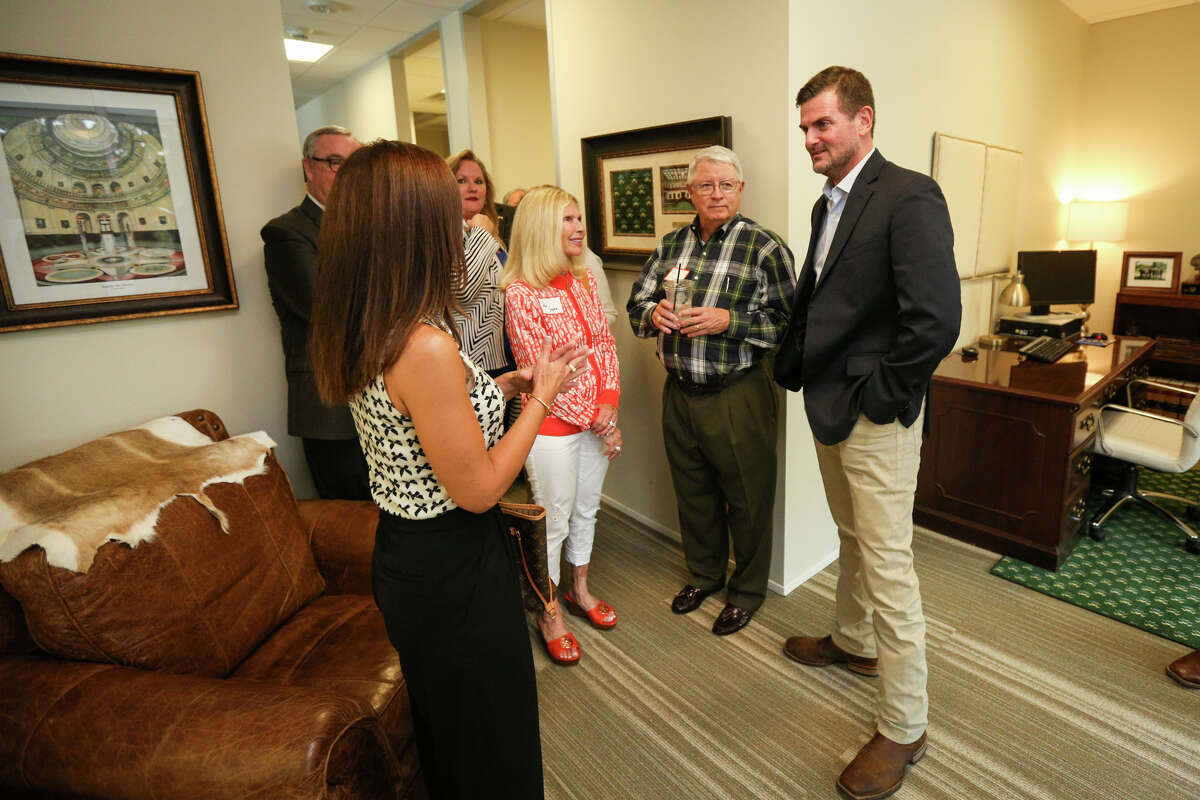 State Sen. Brandon Creighton, R-Conroe, chats with attendees of the open house on Tuesday, July 11, 2017, at Sen. Creighton's office in The Woodlands.