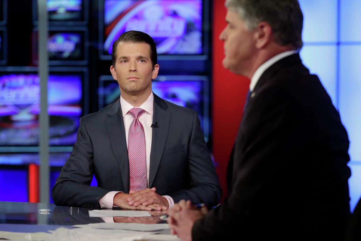 Donald Trump Jr., left, is interviewed by host Sean Hannity on his Fox News Channel television program. (AP Photo/Richard Drew)