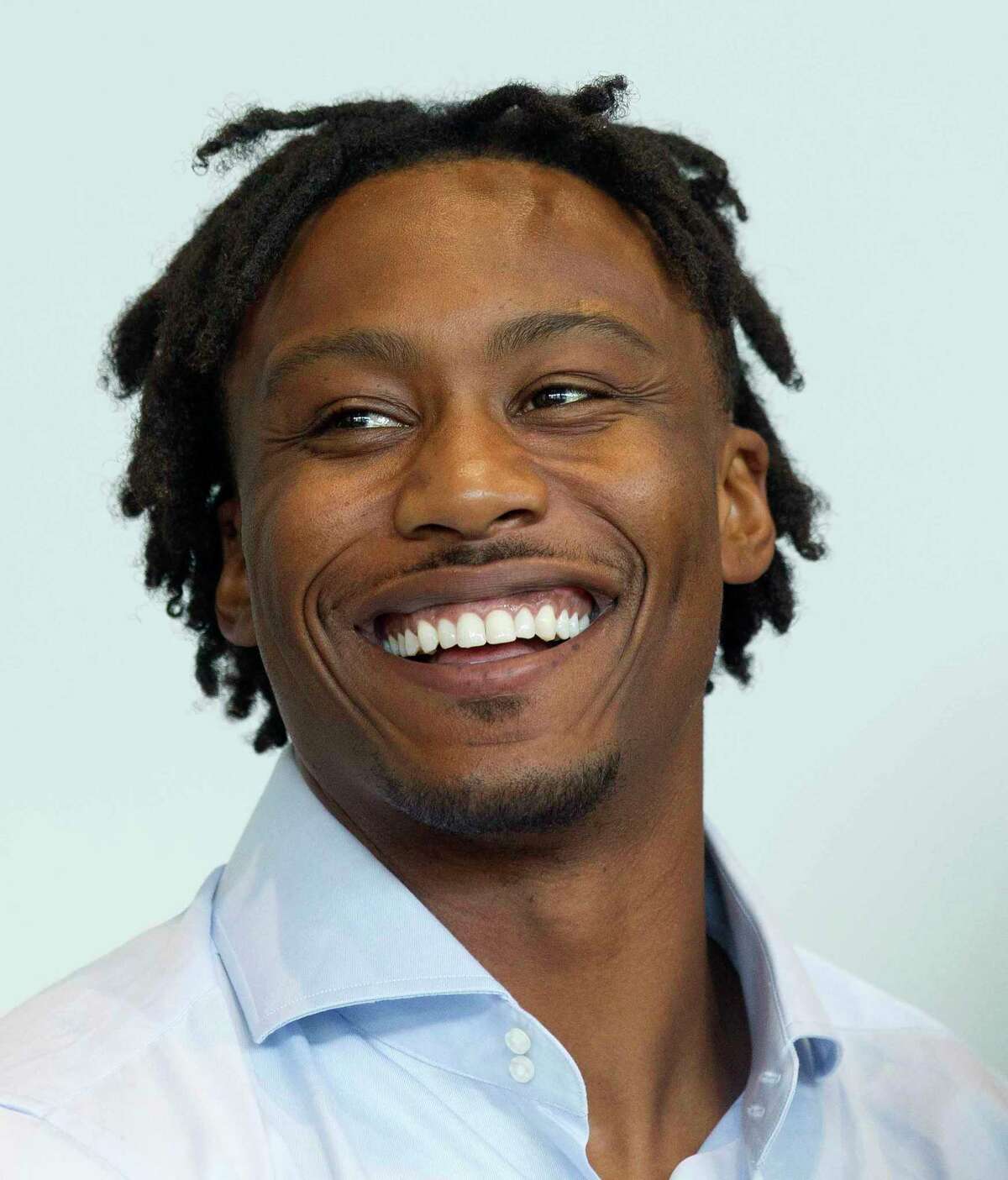 Brandon Marshall, NFL wide receiver with the New York Giants, laughs during a sports forum titled "Going Pro" at The Woodlands Country Club, Wednesday, July 12, 2017, in The Woodlands. The 10-person panel comprised of athletes, health care providers and others from the sports industry offered advice and answered questions about college recruitment and competing at the professional level.