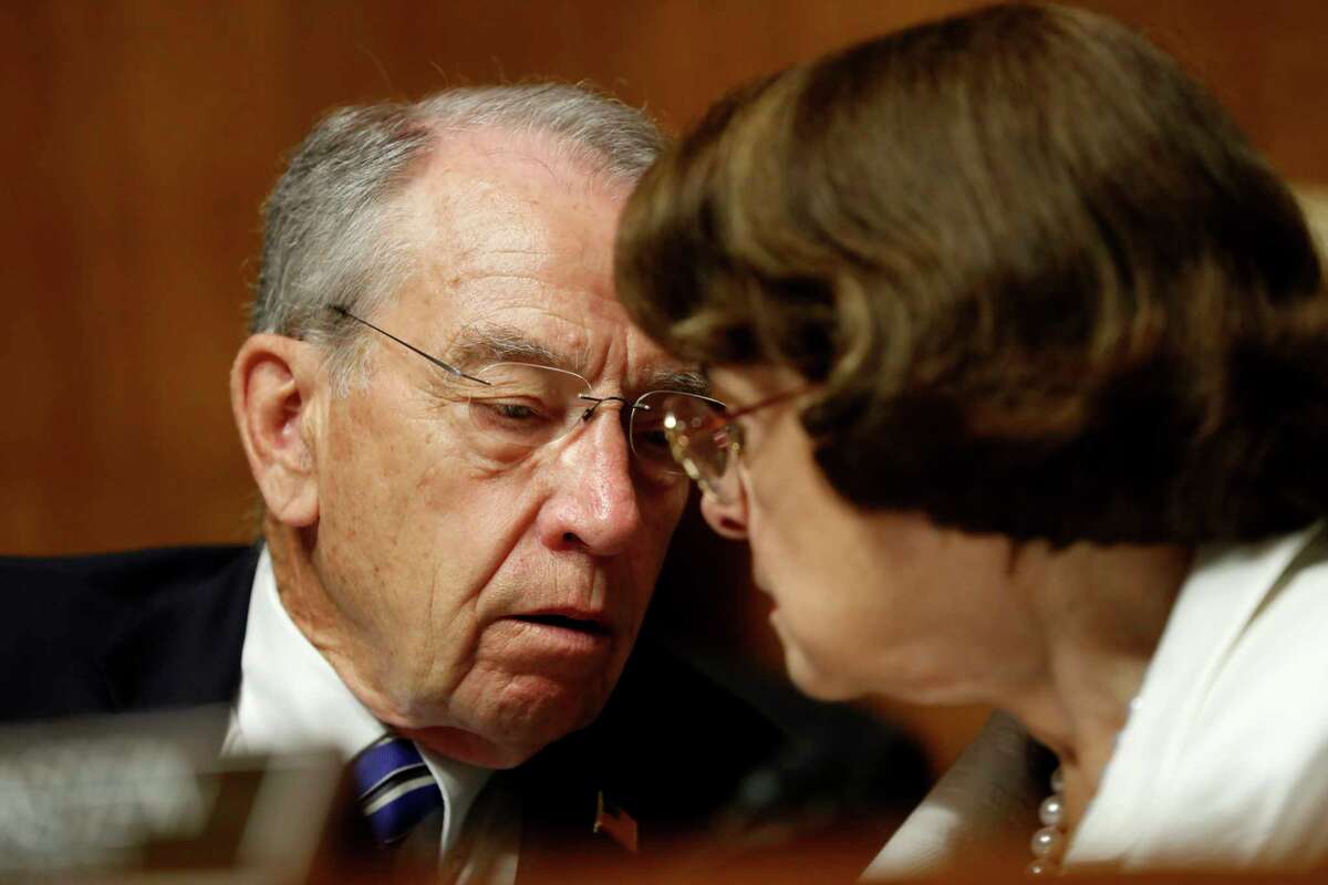 Senate Judiciary Committee Chairman Sen. Chuck Grassley, R-Iowa, talks with the Committee's ranking member Sen. Dianne Feinstein, D-Calif., on Capitol Hill in Washington, Wednesday, July 12, 2017, during the committee's confirmation hearing for FBI Director nominee Christopher Wray. (AP Photo/Pablo Martinez Monsivais)